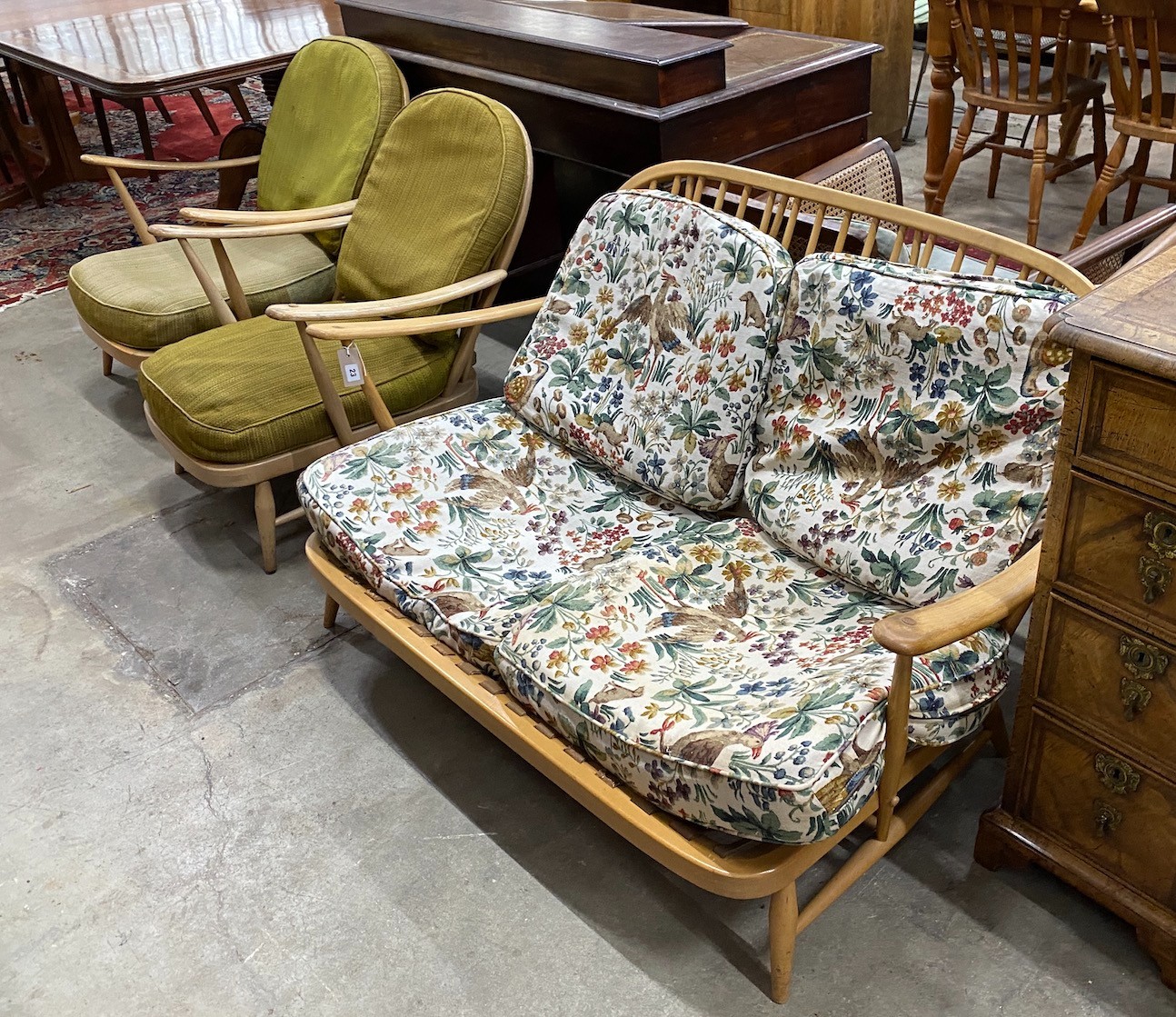 An Ercol light beech three piece lounge suite, settee length 134cm, width 75cm, height 75cm